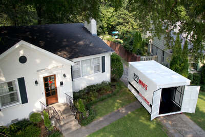 Go Mini's moving container with doors open sitting in a driveway